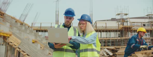 Engineers Checking Blueprints