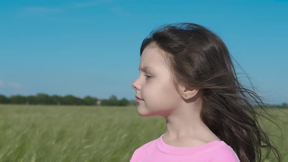 Kid admires the countryside. 