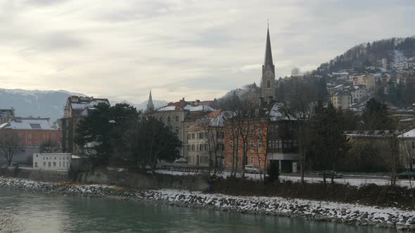 Buildings and a clock tower near Inn River, Innsbruck