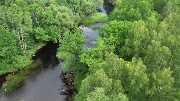 Aircraft flying along Emån river in Sweden, summertime