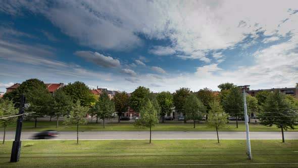 Europe Street Tramline Cars Trees and Houses Timelapse