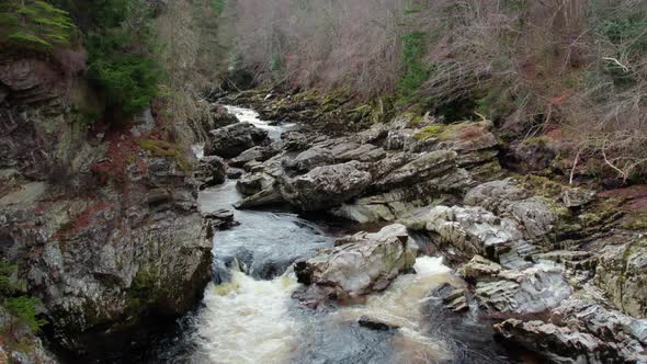 aerial view of wilderness waterfall stream of clear water in Findhorn village in Moray, Scotland.