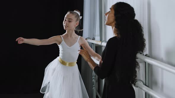 Caucasian Girl Teenager Student Ballerina in Tutu Doing Dancing Exercises Near Ballet Barre