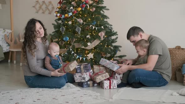 Young Family Spending Christmas Morning Together