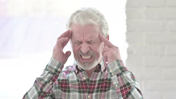 Portrait of Casual Old Man Having Headache 