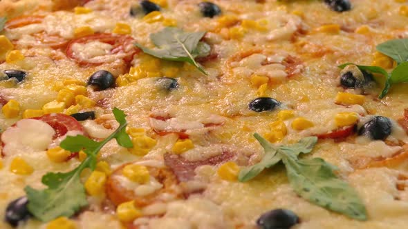 Pizza Close-up. Delivery of Products. Pizza with Cheese, Tomatoes and Olives