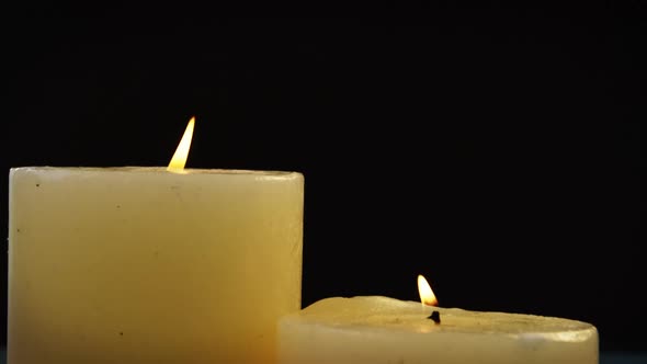 Close-up of candles with flame