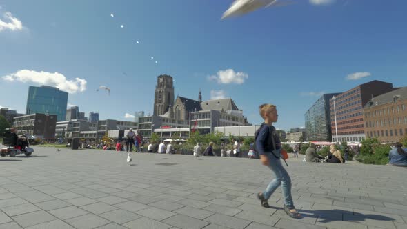 Child having fun and dancing on city street, Rotterdam