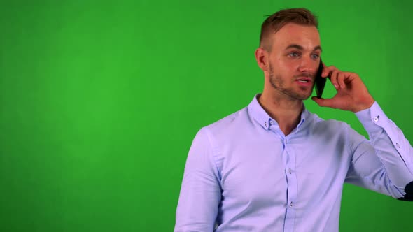 Young Handsome Business Man Phones with Smartphone - Green Screen - Studio