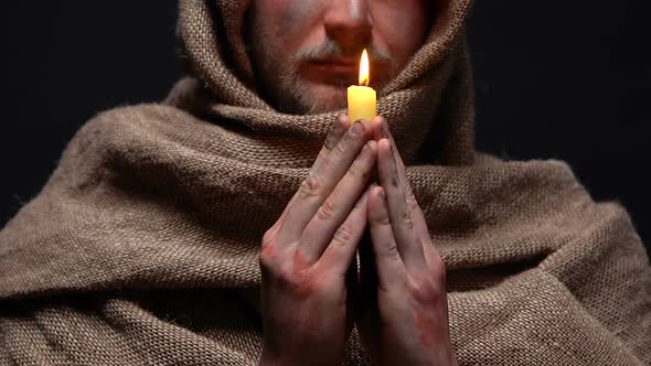 Miserable Man Praying With Burning Candle in Hands, Asking for Forgiveness, Hope