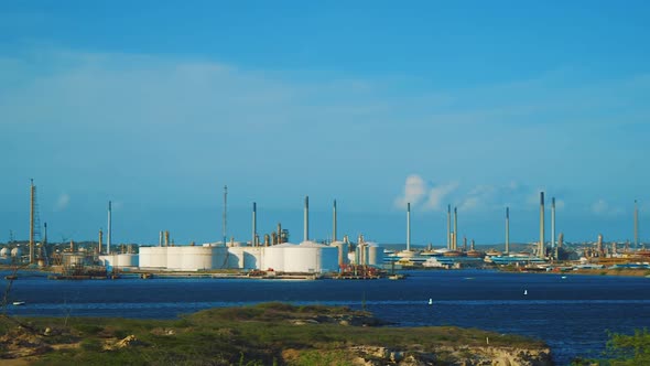 The peaceful oil refinery in Isla, Curacao - Wide pan shot