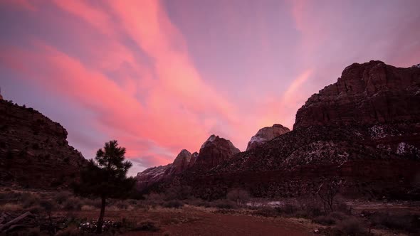 Time lapse of colorful sky in Zion as it fades away over cliffs