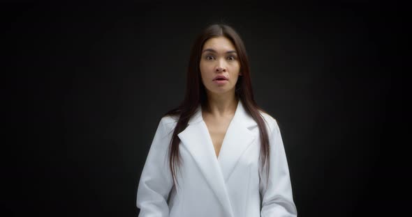 Horizontal Shot of an Asian Shocked Woman