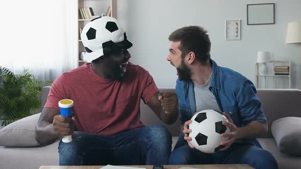 Male Football Fans Roaring Excitedly After National Team Scored Goal, Slow-Mo