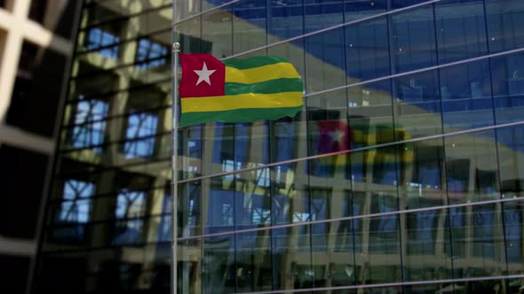 Togo Flag Waving On A Skyscraper Building