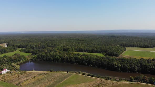 Aerial view of the meadow, forest and lakes. Aerial view of the village.