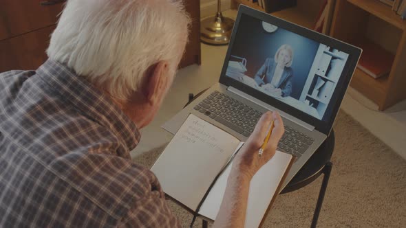 White-haired Man Taking Online Consultation