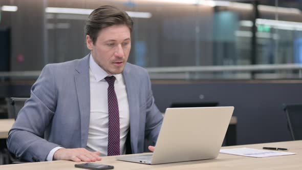 Middle Aged Businessman Leaving Laptop Going Away 