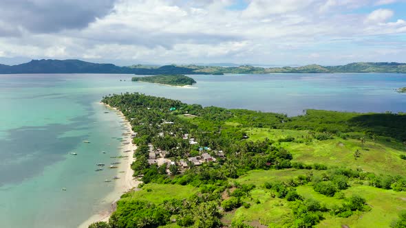 Tropical Island with a Lagoon and White Sandy Beach