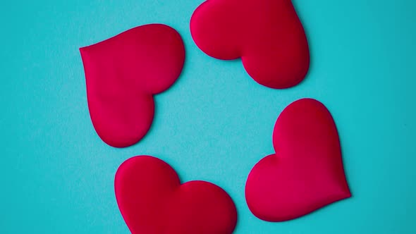 Rotating Red Hearts on Blue Background  Valentine's Day Concept