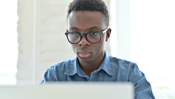 Portrait of Hardworking Young African Man Working on Laptop