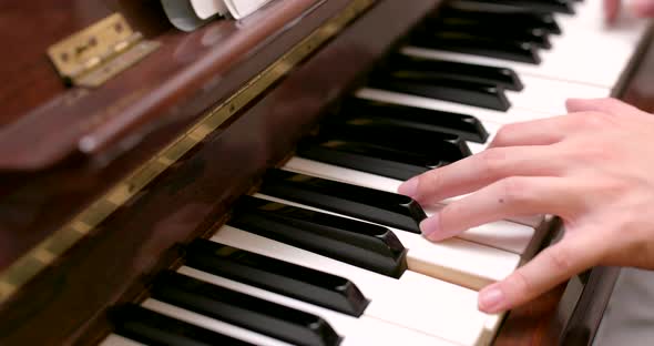 Man practicing piano at home