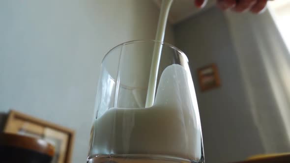 Pouring Milk Into Glass in Slowmotion