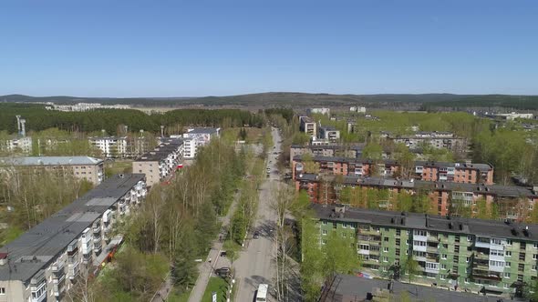 Aerial view of the central street in a provincial town with two- and five-story houses 06