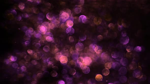 Purple Glitter in Blur on a Black Background