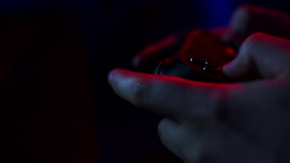 Closeup Man's Hands Holding Gamepad and Pressing Buttons While Playing Video Games on Console