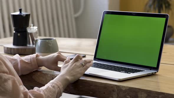 Woman Working At The Computer With Green Screen