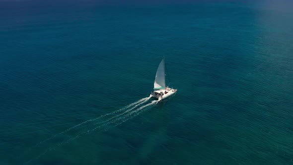 Catamaran in Turquoise Water Against the Background of the Paradise Island Mauritius