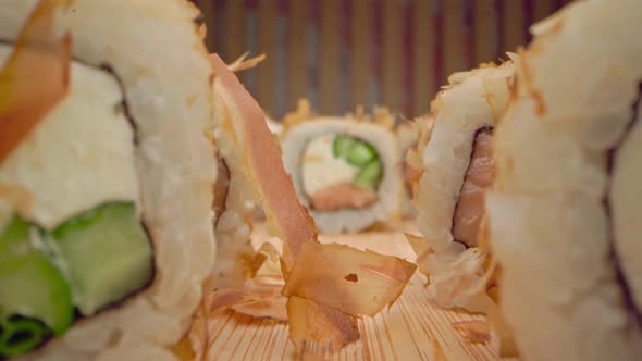 Zoom in Slide Video of Japanese Sushi Roll on Wooden Background