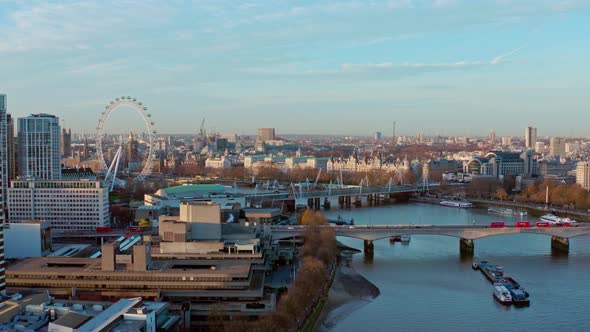 Establishing Aerial drone slider shot of thames river London eye Westminster at sunrise