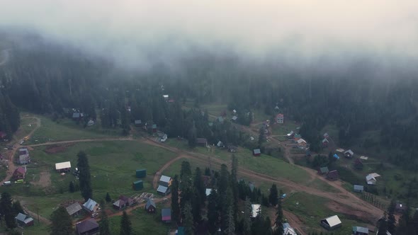 Misty Aerial View Of High Mountain Village