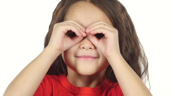 Close-up Little Female Covers Her Eyes with Hands. Slow Motion