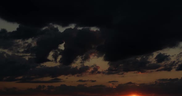 Clouds Fly Across the Sky at Sunset