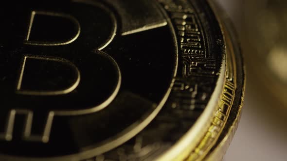 Rotating shot of Bitcoins (digital cryptocurrency) - BITCOIN 0437