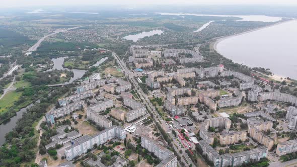 Aerial Panorama on City with Multi-Story Buildings Near Nature and River