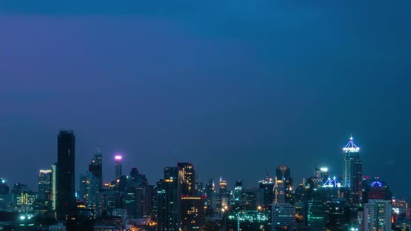 Time lapse night cityscape and high-rise buildings in metropolis city center