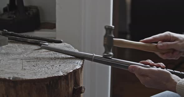 Goldsmith making details on a ring