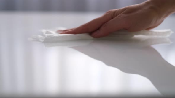 Woman Cleaning and Polishing the Kitchen Worktop with a Spray Detergent Housekeeping and Hygiene