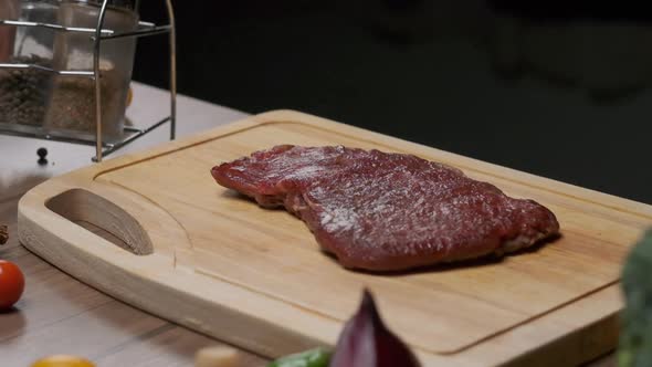 Professional Chef Prepares Steak for Frying