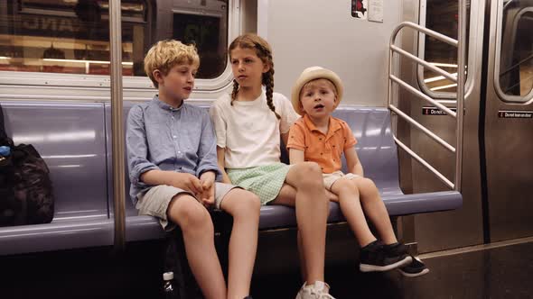 Three Kids Ride Subway