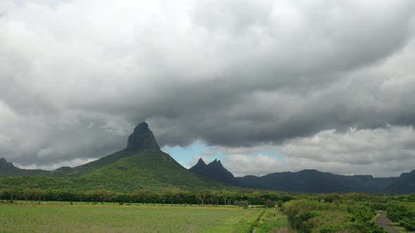 Shooting From Top To Bottom the Peaks of Mountains and Jungles of Mauritius the Sky in Clouds