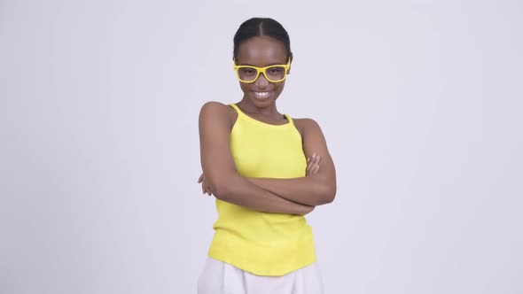 Happy Young Beautiful African Woman Smiling with Arms Crossed