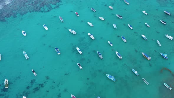 Top Down View with Boats Moored in the Turquoise Water