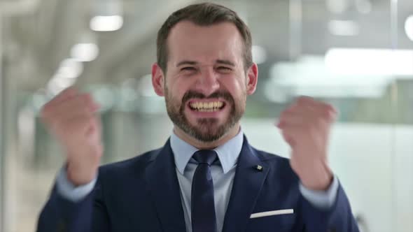 Portrait of Excited Businessman Celebrating Success