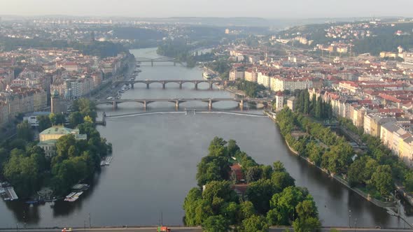 Flying over the bridges on Vltava (Moldau) river, Prague, Czech Republic, Europe