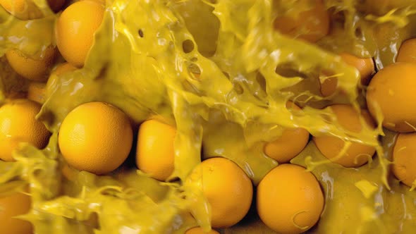 Orange Juice Gushing Through Oranges